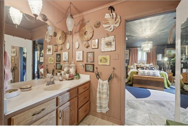 bathroom featuring connected bathroom, a notable chandelier, tile patterned flooring, vanity, and ornamental molding