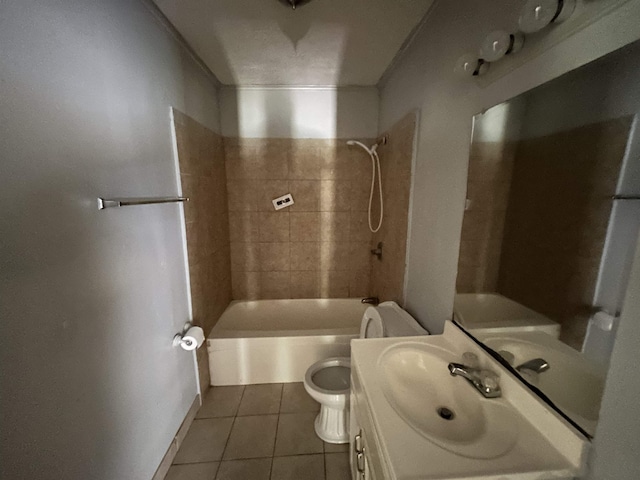 full bathroom featuring tile patterned flooring, vanity, toilet, and tiled shower / bath