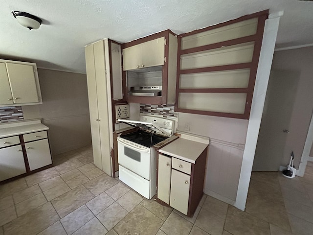 kitchen with ventilation hood, decorative backsplash, light tile patterned flooring, and electric stove