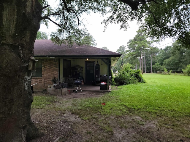 back of house with a yard