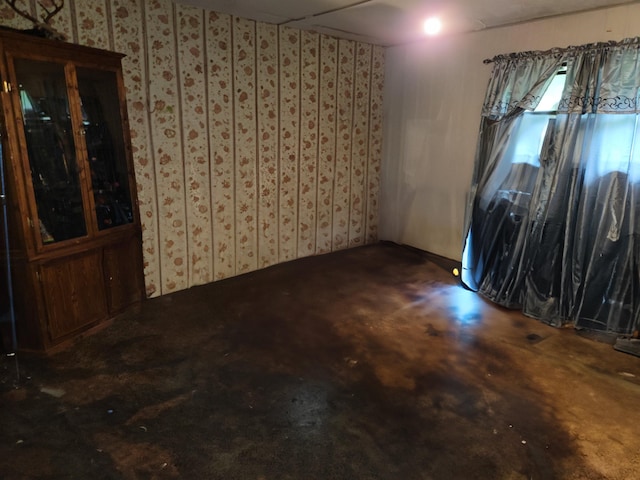 unfurnished room featuring carpet