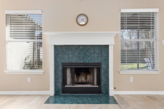 details featuring a tiled fireplace