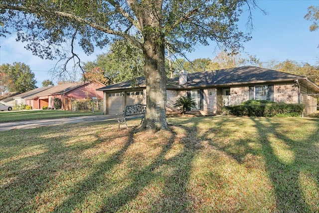 single story home with a front yard and a garage