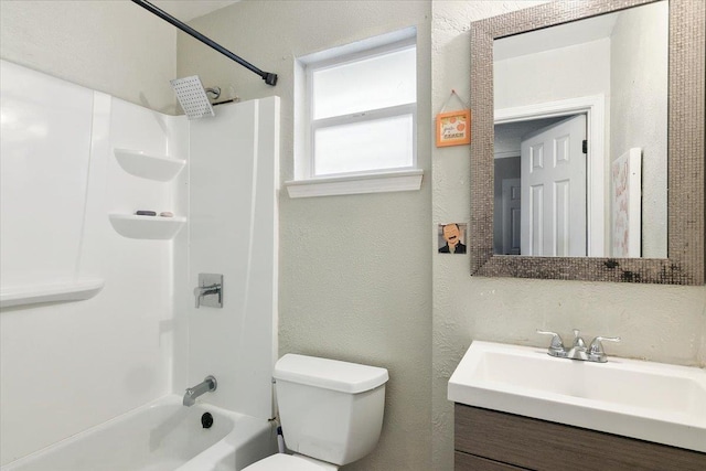 full bathroom with washtub / shower combination, vanity, and toilet