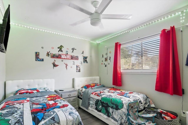 bedroom featuring hardwood / wood-style floors and ceiling fan