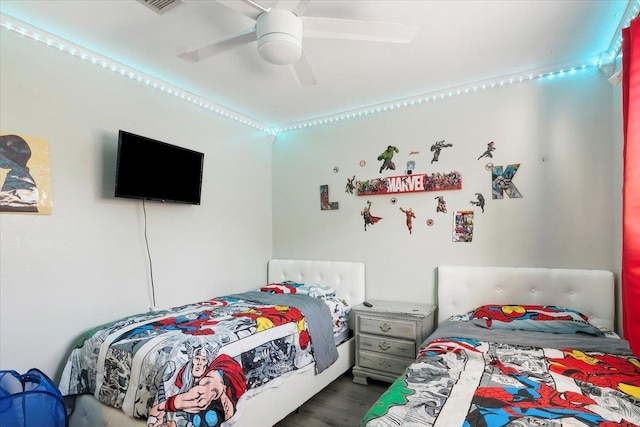 bedroom with hardwood / wood-style flooring and ceiling fan