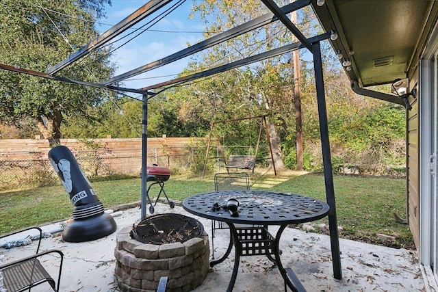 view of patio with an outdoor fire pit