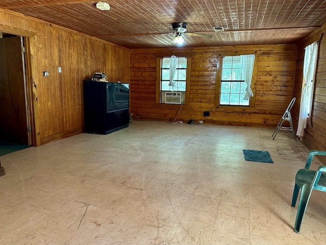 spare room with cooling unit, ceiling fan, wooden walls, and wood ceiling