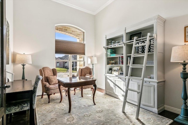 sitting room featuring crown molding