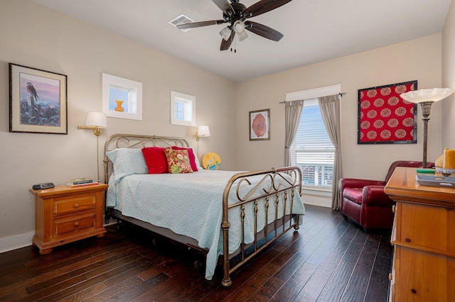 bedroom with a ceiling fan, wood-type flooring, and visible vents