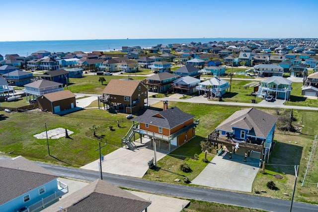 bird's eye view featuring a residential view and a water view