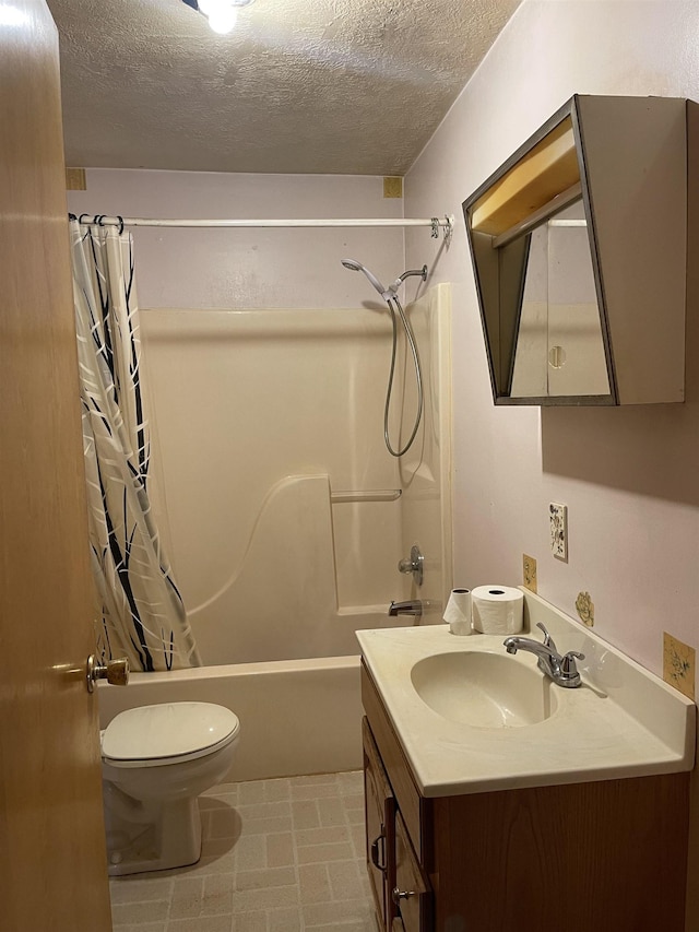 full bathroom featuring vanity, shower / bath combo, a textured ceiling, and toilet