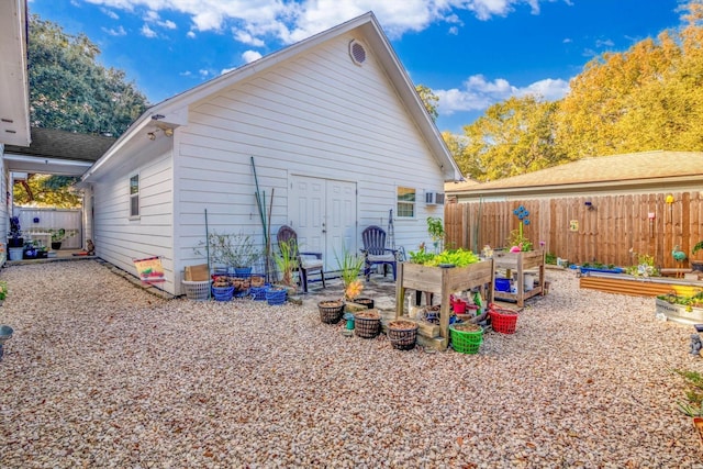 390 N Major Dr, Beaumont, TX 77706 - rear view of house with a garden