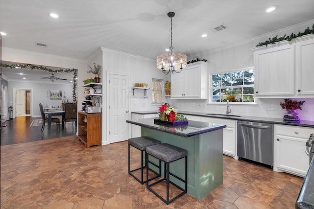 390 N Major Dr, Beaumont, TX 77706 - kitchen with stainless steel dishwasher, a sink, dark countertops, a chandelier, and recessed lighting