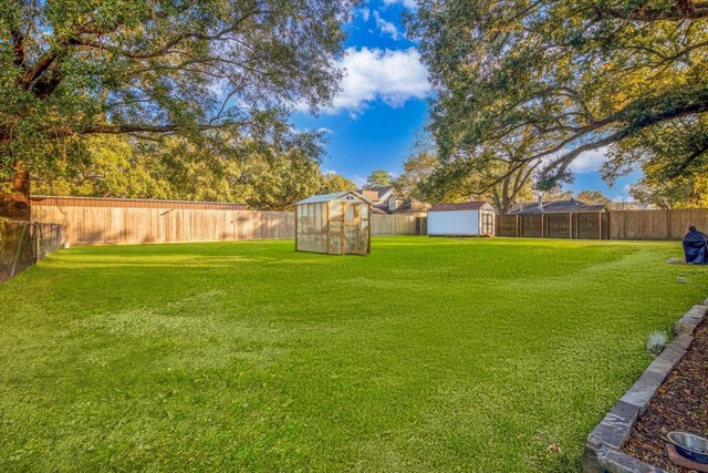 390 N Major Dr, Beaumont, TX 77706 - view of yard with a greenhouse