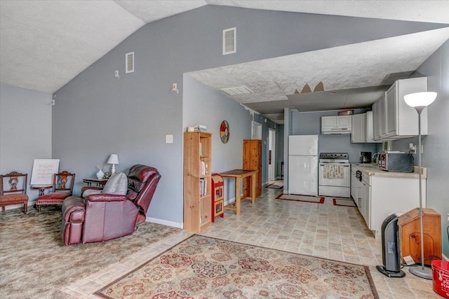 kitchen with white cabinetry, white appliances, and lofted ceiling