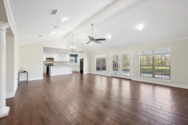 unfurnished living room featuring visible vents, vaulted ceiling with beams, baseboards, ornate columns, and dark wood-style flooring