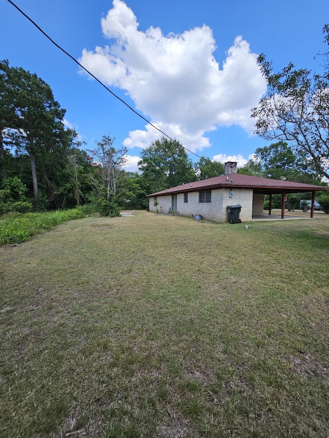 view of yard featuring a carport