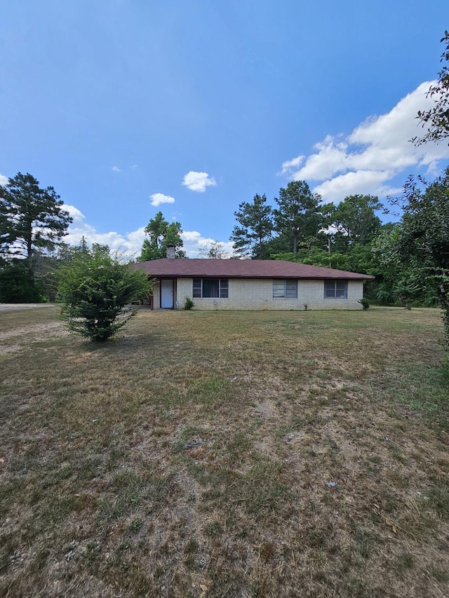 ranch-style home with a front lawn