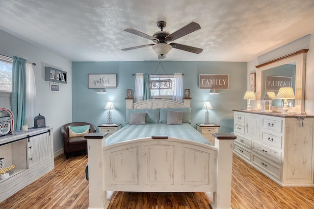 bedroom featuring ceiling fan and light hardwood / wood-style floors