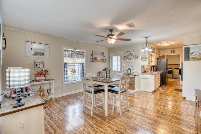 dining area with ornamental molding, light hardwood / wood-style floors, and ceiling fan