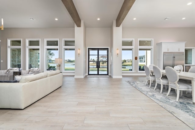 living room featuring beamed ceiling