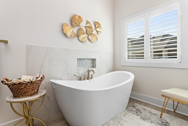 bathroom featuring a bathing tub and wood-type flooring