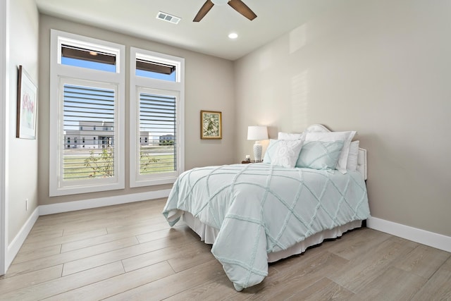 bedroom featuring light wood-type flooring and ceiling fan