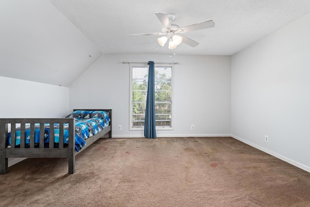 carpeted bedroom featuring ceiling fan, lofted ceiling, and a textured ceiling