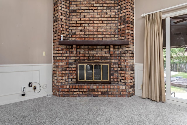 details with carpet floors and a brick fireplace