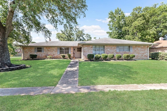 ranch-style house with a front lawn