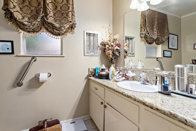 bathroom featuring tile patterned flooring, vanity, and ornamental molding