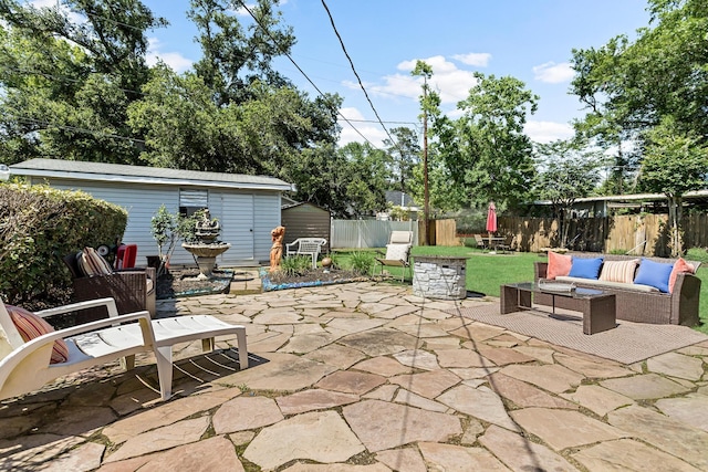 view of patio with a storage shed