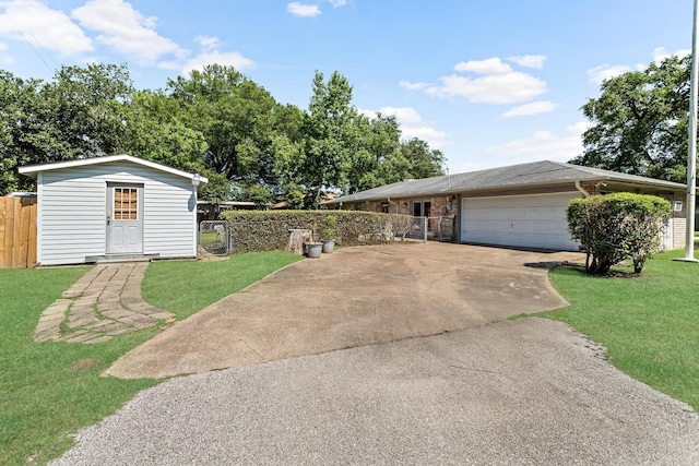 view of front of home featuring a front lawn and a garage