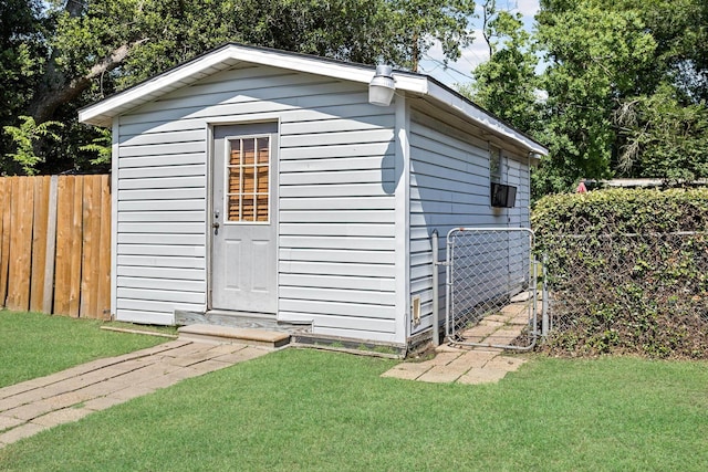 view of outdoor structure featuring a yard