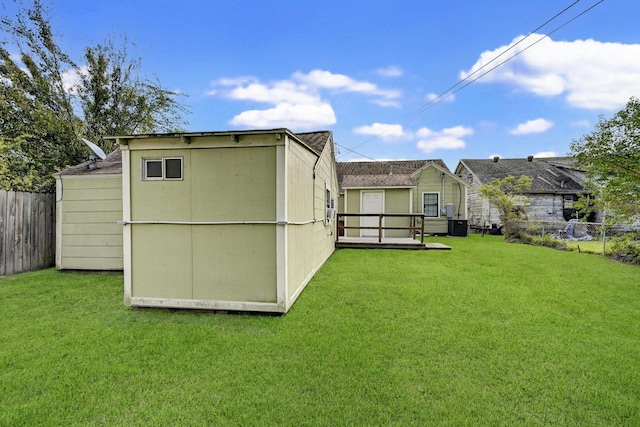 view of outbuilding with a lawn