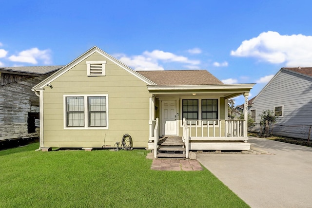 bungalow with a porch and a front yard