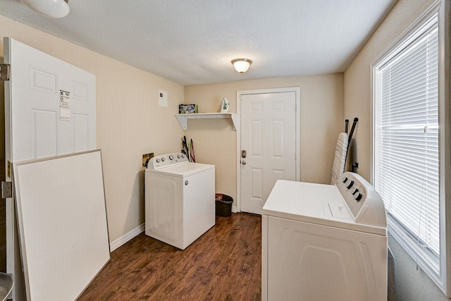 clothes washing area featuring dark hardwood / wood-style flooring, a textured ceiling, and independent washer and dryer