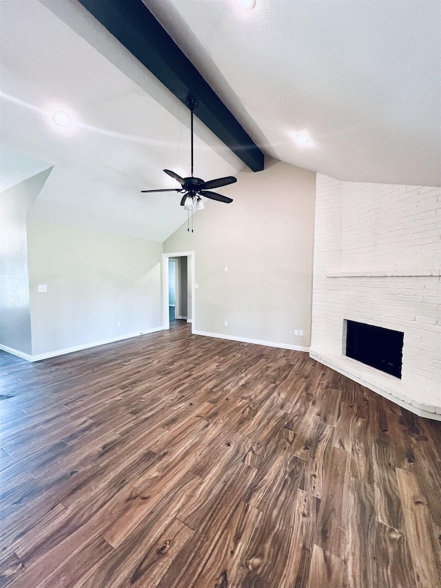 2411 Post Oak Ln, Groves, TX 77619 - unfurnished living room featuring dark wood-type flooring, a fireplace, and a ceiling fan