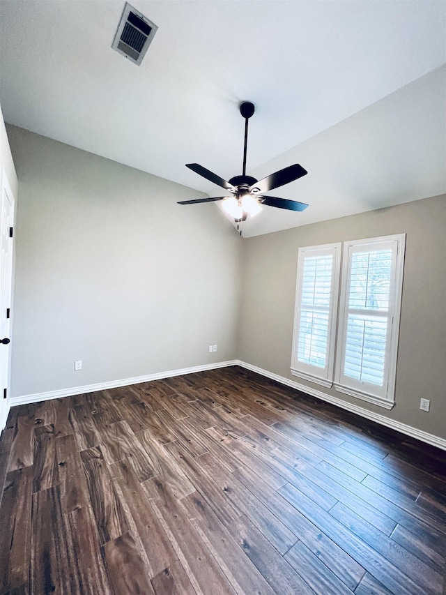 2411 Post Oak Ln, Groves, TX 77619 - unfurnished room with a ceiling fan and dark wood finished floors