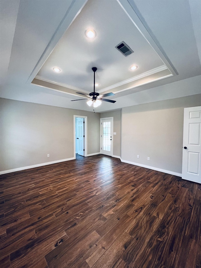 2411 Post Oak Ln, Groves, TX 77619 - spare room with a tray ceiling, ceiling fan, dark wood-style flooring, recessed lighting, and ornamental molding
