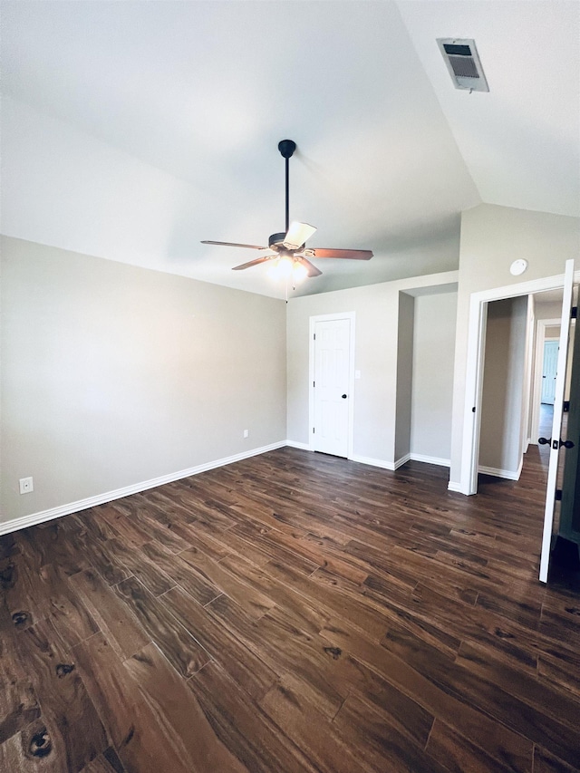 2411 Post Oak Ln, Groves, TX 77619 - unfurnished bedroom featuring dark wood-style flooring, lofted ceiling, and ceiling fan