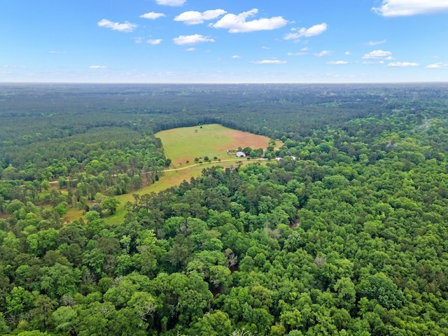 birds eye view of property with a view of trees