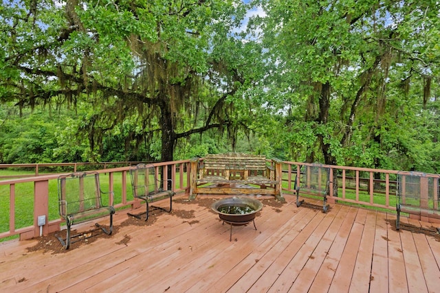deck featuring an outdoor fire pit