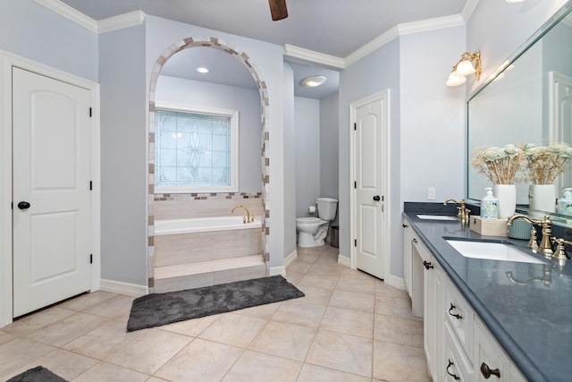 bathroom with tile patterned flooring, tiled tub, toilet, vanity, and ornamental molding