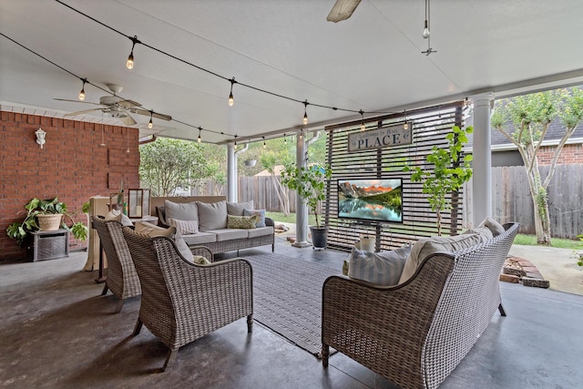 view of patio with ceiling fan and an outdoor hangout area