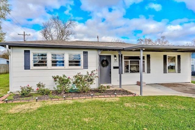 ranch-style home with a patio and a front yard