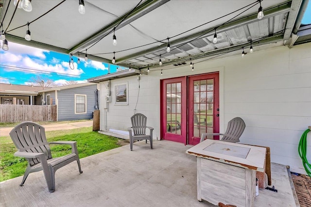 view of patio / terrace with fence and french doors