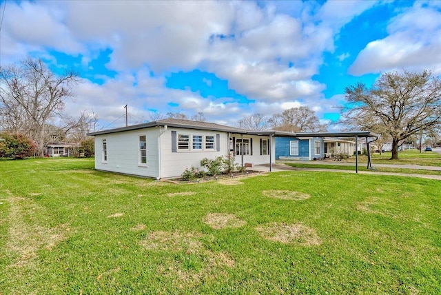 single story home with a carport and a front yard