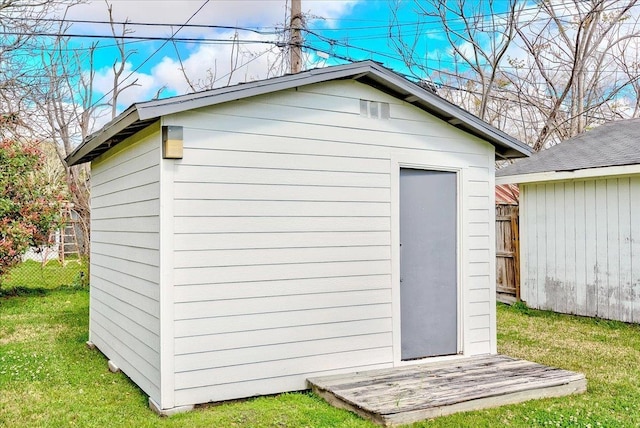 view of shed with fence